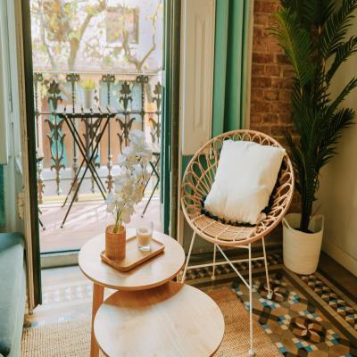 Cosy Modern Balcony Design with Wooden Tables and Chairs